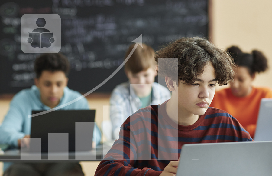 Students focused on working on laptops in a classroom. A transparent graphic of a bar chart with an upward trend is overlaid on the image, suggesting progress or growth in learning or technology usage.